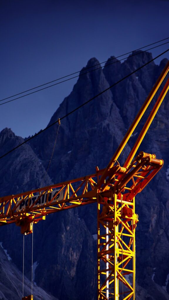 close-up photo of orange truck crane